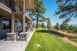 Experience luxury living with this stunning property featuring a multi-level deck and expansive lawn perfect for outdoor entertaining.