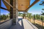 Experience breathtaking panoramic views from this stunning modern home's expansive deck, perfect for entertaining or quiet relaxation.