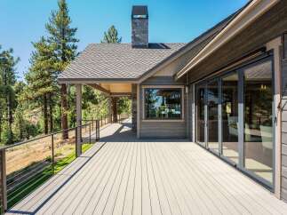 Experience seamless indoor-outdoor living with this expansive deck, perfect for entertaining or enjoying the serene natural surroundings.