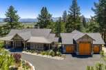 Experience luxury mountain living in this stunning custom-built home, nestled amidst towering pine trees with breathtaking valley views.