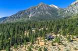 Nestled amidst a dense pine forest, this stunning property offers a serene mountain retreat.