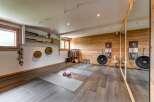 Discover this serene yoga and meditation studio, featuring a calming ambiance with natural wood accents and soft lighting.