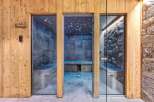 Experience ultimate relaxation in this luxurious spa area, featuring a modern hammam and a stone-clad sauna.