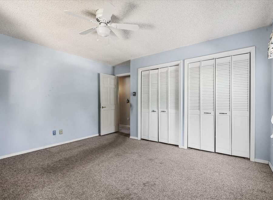 Discover ample storage in this spacious bedroom, featuring two large bi-fold closet doors.