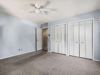Discover ample storage in this spacious bedroom, featuring two large bi-fold closet doors.