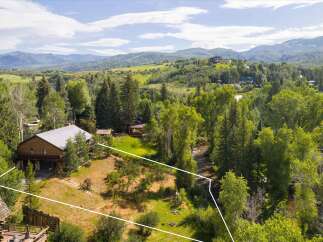 Nestled amidst lush greenery and rolling hills, this property offers a serene mountain retreat.