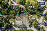 Discover prime real estate with this aerial view showcasing a property adjacent to Soda Creek, offering a serene natural setting.