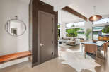 Step into modern luxury with this stunning entryway featuring a sleek, minimalist design.