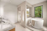 Experience modern luxury in this stunning bathroom, featuring a sleek freestanding bathtub positioned by a large window with lush green views.