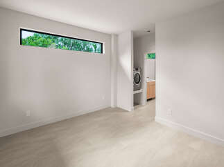 Discover modern living in this spacious room featuring a unique horizontal window that floods the space with natural light.