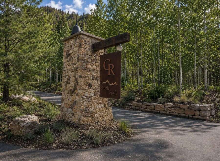 Welcome to Castle Rock, a stunning property nestled amidst a serene forest landscape.