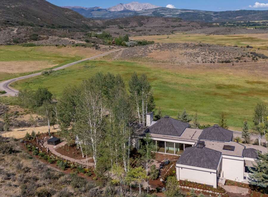 Nestled amidst rolling hills and mature aspen trees, this stunning property offers a serene mountain retreat.