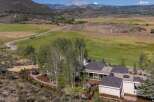 Nestled amidst rolling hills and mature aspen trees, this stunning property offers a serene mountain retreat.