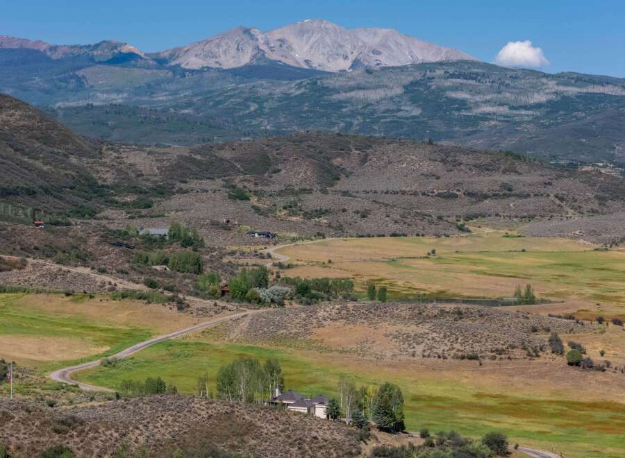 Discover this stunning property nestled amidst rolling hills and expansive meadows, offering breathtaking panoramic views of majestic mountains.