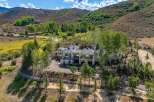Experience luxury mountain living in this stunning contemporary estate, nestled amidst rolling hills and mature trees.