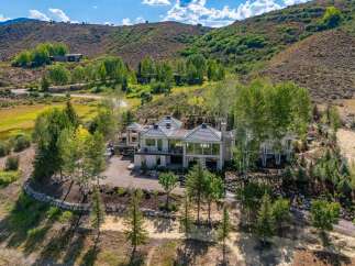 Experience luxury mountain living in this stunning contemporary estate, nestled amidst rolling hills and mature trees.