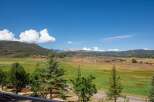 Experience breathtaking panoramic views of rolling hills and distant mountains from this stunning property.