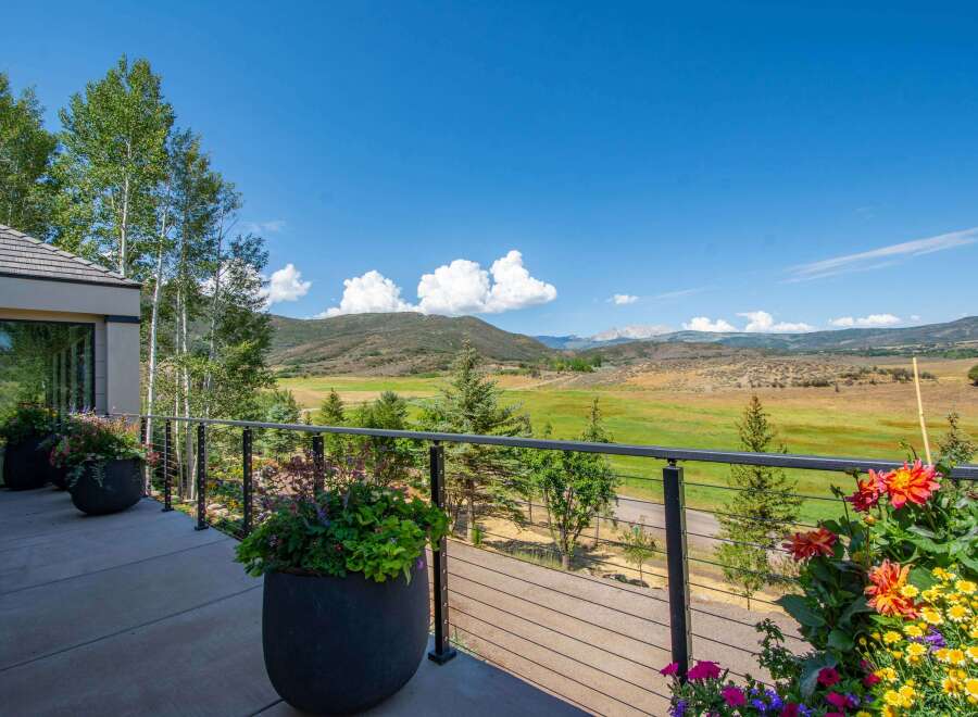 Enjoy breathtaking mountain views from this stunning property's expansive balcony, perfect for outdoor entertaining or quiet relaxation.