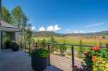 Enjoy breathtaking mountain views from this stunning property's expansive balcony, perfect for outdoor entertaining or quiet relaxation.