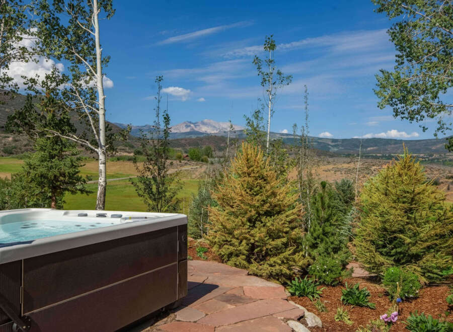Experience ultimate relaxation with this luxurious hot tub, perfectly situated to offer breathtaking mountain views.