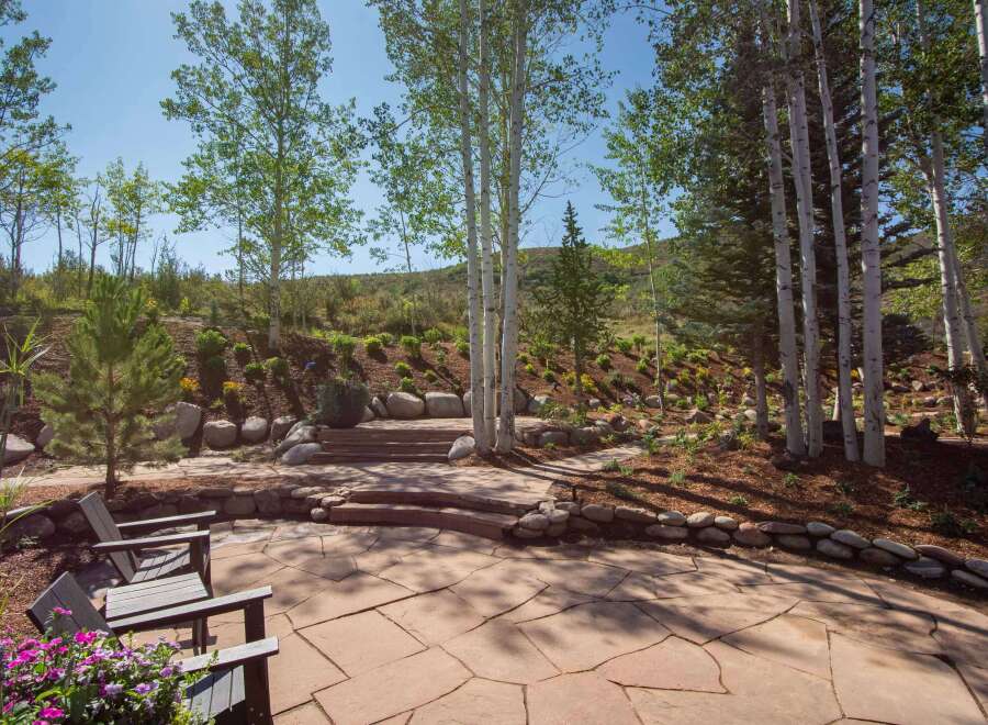 Experience the beauty of mountain living with this stunning outdoor patio, perfect for entertaining or quiet relaxation.