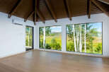 Experience breathtaking mountain views from this stunning room, featuring expansive windows that frame the picturesque landscape.