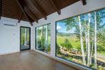 Experience breathtaking mountain views from this stunning property, featuring expansive windows that bring the outdoors in.