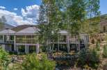 Experience luxury mountain living in this stunning contemporary home, featuring expansive windows that capture breathtaking natural light and scenic views.
