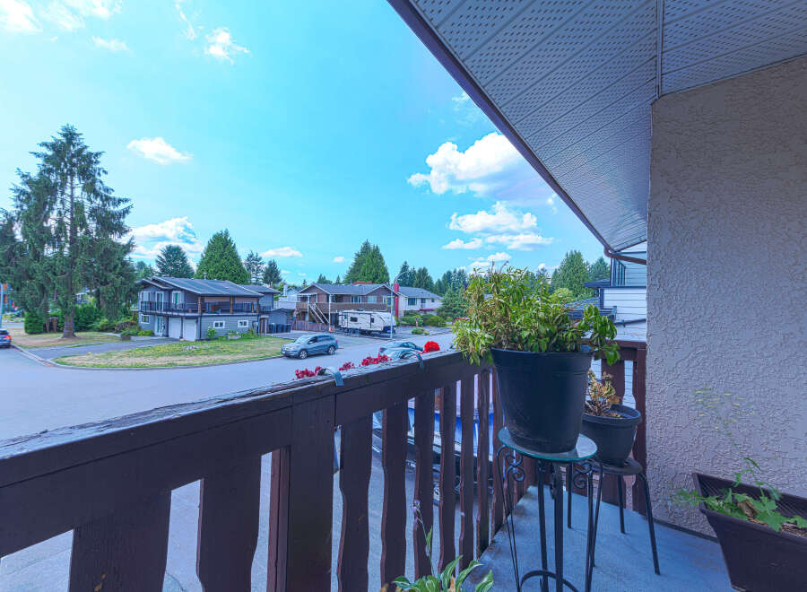 Enjoy outdoor living from this charming balcony overlooking a quiet suburban street lined with mature trees.