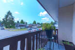 Enjoy outdoor living from this charming balcony overlooking a quiet suburban street lined with mature trees.