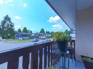 Enjoy outdoor living from this charming balcony overlooking a quiet suburban street lined with mature trees.