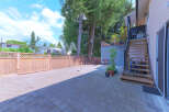 Discover this spacious backyard with a paved patio, perfect for outdoor entertaining.