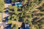 Discover this charming property nestled among mature pine trees, offering a serene and private setting.
