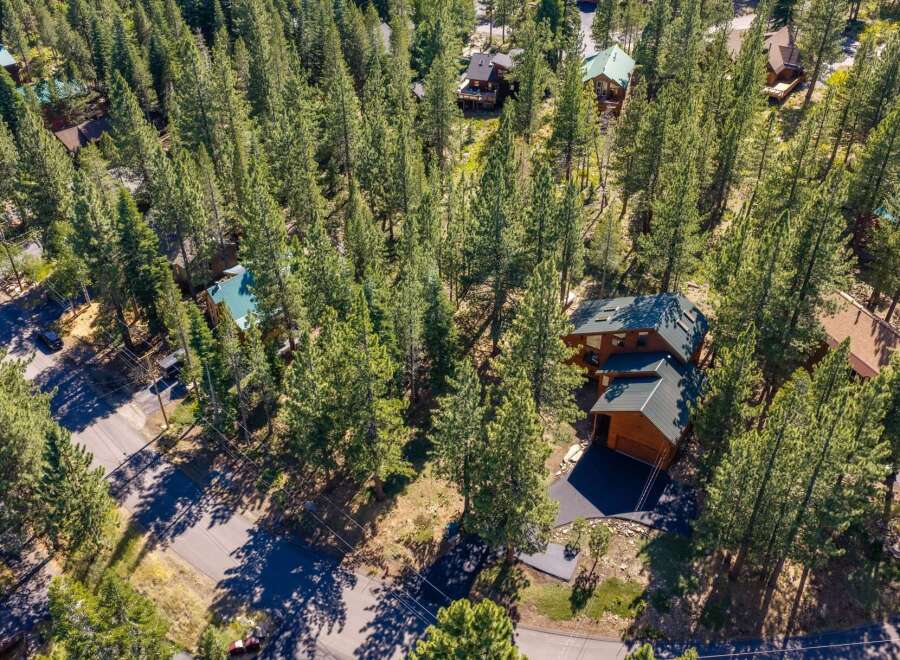 Nestled amidst towering pine trees, this property offers a serene mountain retreat.