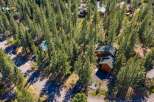 Nestled amidst towering pine trees, this property offers a serene mountain retreat.