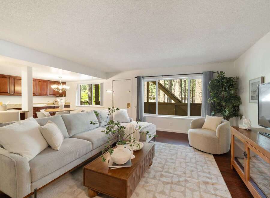 Step into this inviting living space featuring a plush sectional sofa and a stylish coffee table, perfect for relaxation and entertaining.