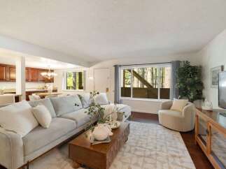 Step into this inviting living space featuring a plush sectional sofa and a stylish coffee table, perfect for relaxation and entertaining.