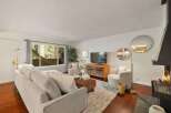 Experience cozy living in this inviting living room, featuring a plush sectional sofa perfect for relaxation.