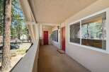 Discover this charming property featuring two inviting red doors, perfect for a duplex or multi-unit dwelling.