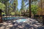 Enjoy a refreshing dip in the sparkling pool or relax in the soothing hot tub, surrounded by tall pine trees.