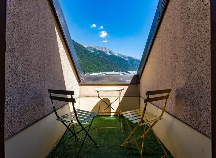 Enjoy breathtaking mountain views from this charming balcony, perfect for your morning coffee or evening relaxation.