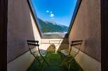 Enjoy breathtaking mountain views from this charming balcony, perfect for your morning coffee or evening relaxation.