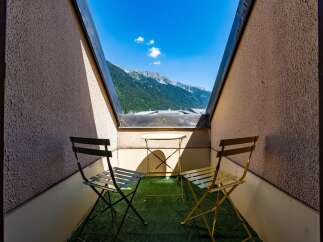 Enjoy breathtaking mountain views from this charming balcony, perfect for your morning coffee or evening relaxation.