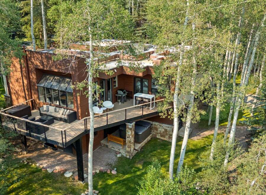 Experience luxury living in this stunning modern home nestled amongst mature aspen trees.