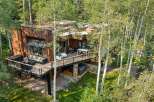 Experience luxury living in this stunning modern home nestled amongst mature aspen trees.