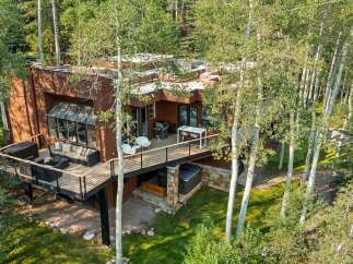 Experience luxury living in this stunning modern home nestled amongst mature aspen trees.