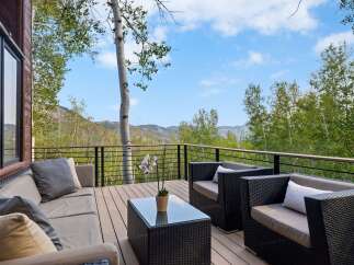 Enjoy breathtaking mountain views from this expansive deck, perfect for outdoor entertaining.
