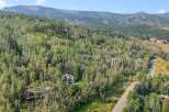Nestled amidst a lush forest, this property offers a serene mountain retreat with stunning natural beauty.
