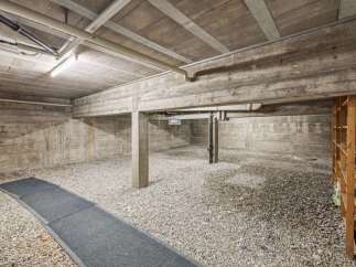 Discover this spacious unfinished basement, perfect for storage or customization.