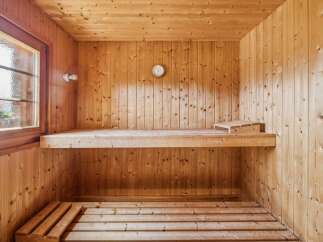 Experience ultimate relaxation in this beautifully crafted wooden sauna.